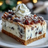 The baked Christmas Cheesecake Slab in a rectangular pan, featuring a golden crust and speckled with festive dried fruits.