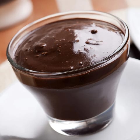Chocolate Pudding served chilled in elegant verrines, garnished with dark chocolate shavings for a decadent treat.