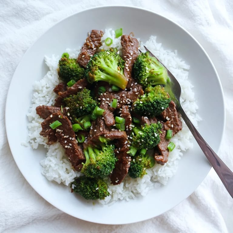 Tender beef and crisp broccoli florets tossed in a glossy soy-garlic sauce for Beef and Broccoli.