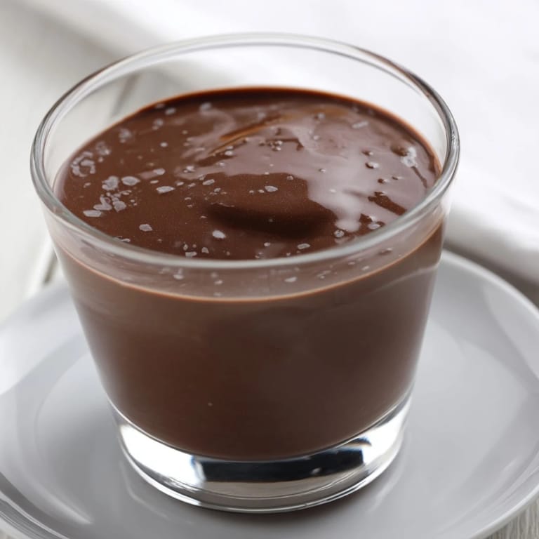 Silky smooth Chocolate Pudding with a velvety texture, ready to enjoy as a delicious homemade dessert.